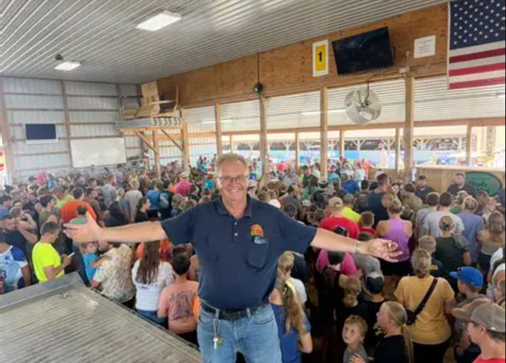 Clark with arms open